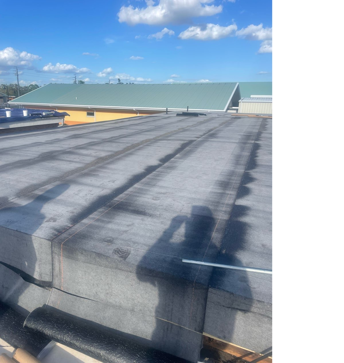 Storm-related deficiencies documented on a commercial roof in Southwest Florida