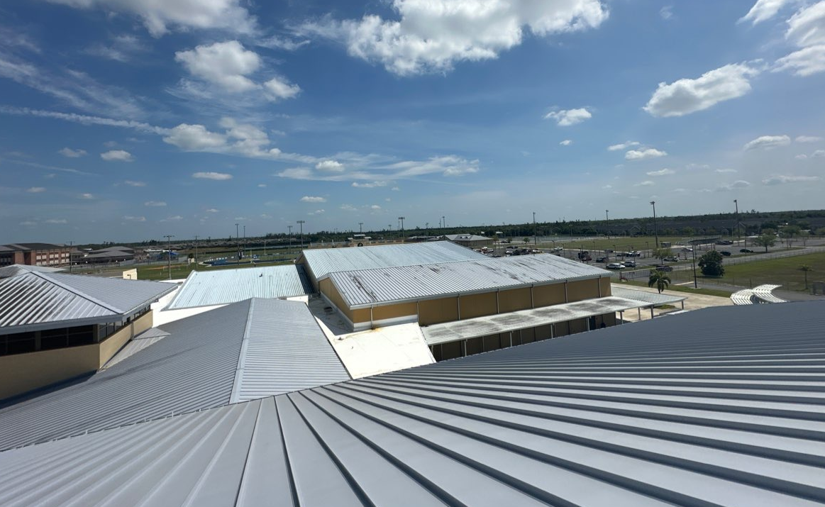 Wind-related damage on a Southwest Florida commercial flat roof