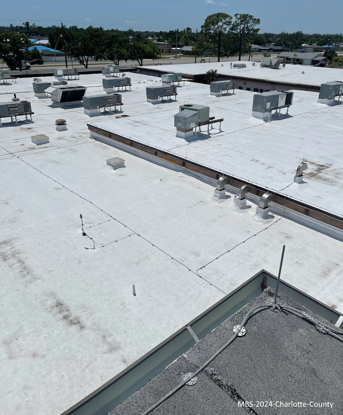 Storm-damaged commercial roof documented during a MBS Florida onsite inspection